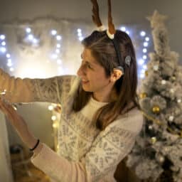 Woman with hearing device decorates for holiday