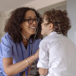ENT provider listening to a child's cough