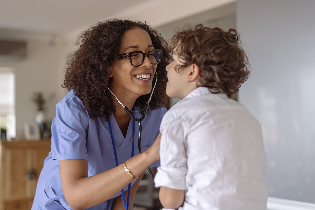 ENT provider listening to a child's cough.     