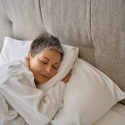 Senior woman sleeping in bed