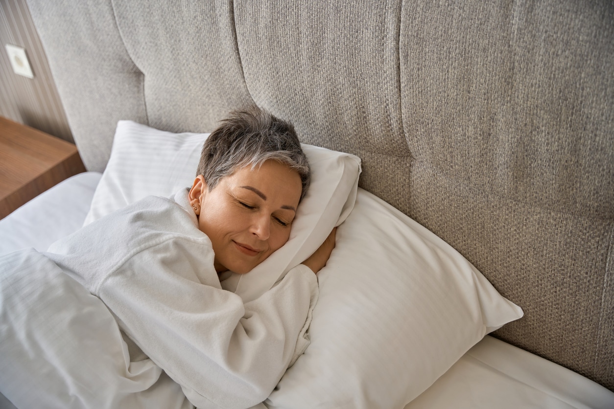 Senior woman sleeping in bed