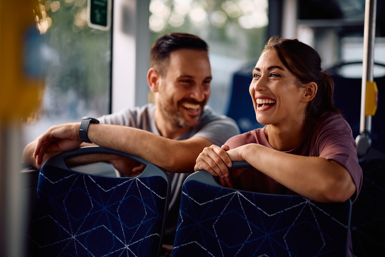 Happy friends on a city bus